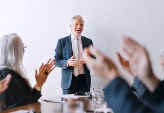 people clapping for a presenter