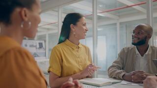 businesspeople brainstorming in a meeting