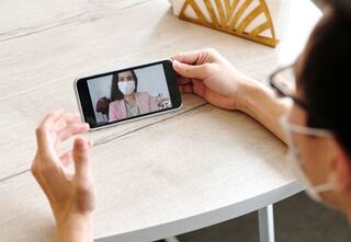 person engaged in a video chat on a mobile device